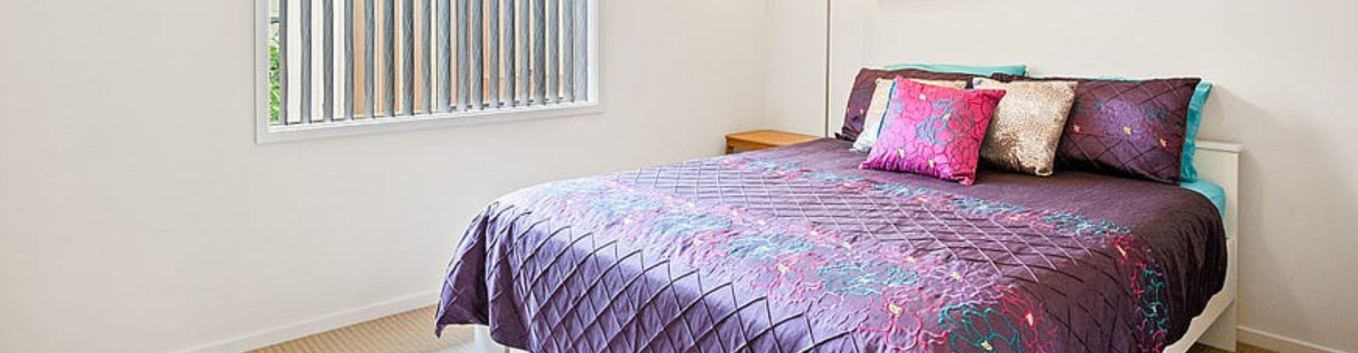 Bedroom with purple bed